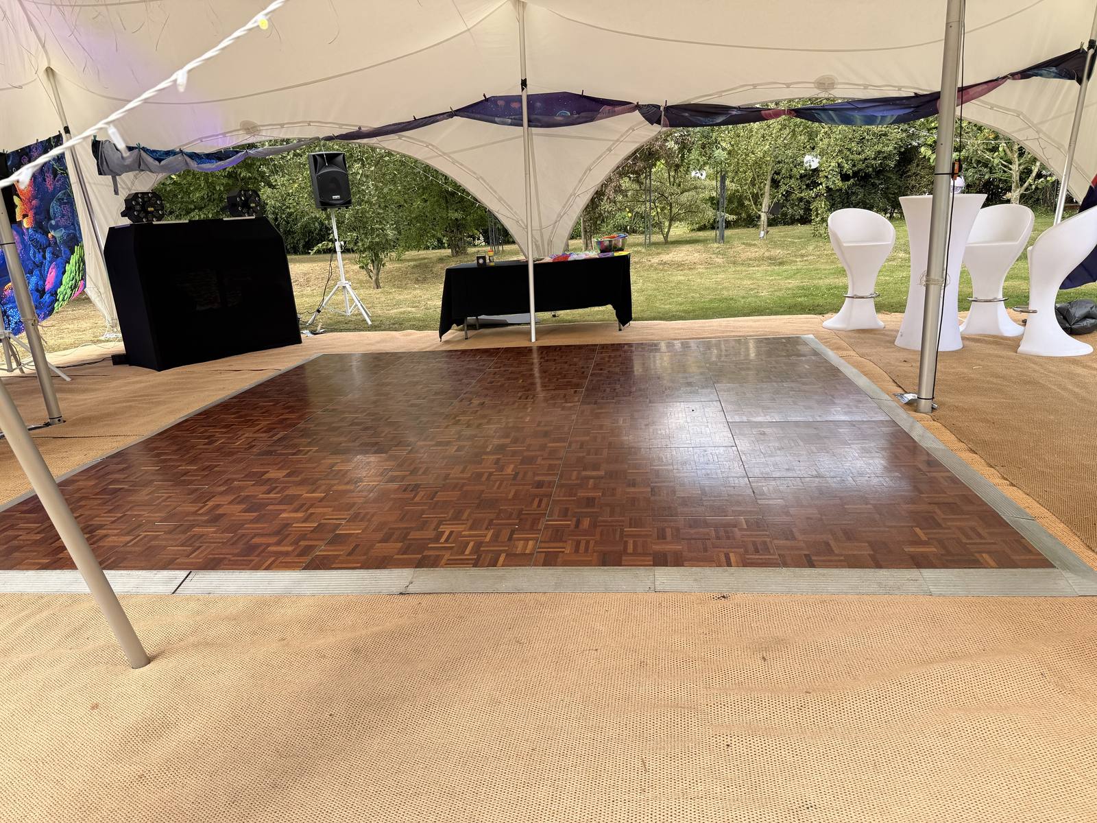 Close view of the wooden parquet dancefloor finish under a stretch tent